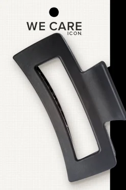 WE CARE ICON. hiusklipsi, musta